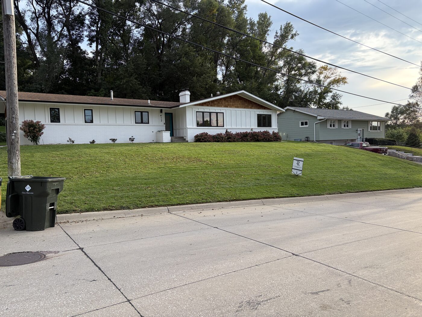 Well-maintained lawn on a sloped front yard in Sioux City